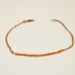Bracciale di catena rolò dorata con centro di zirconi sintetici arancioni infilati in filo rigido cm 18